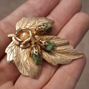 Gold-Tone Leaf Brooch with Green Stone Accents and Faux Pearl